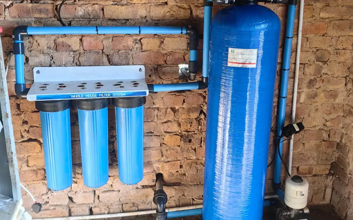 Whole-house filter system with water softener and booster pump